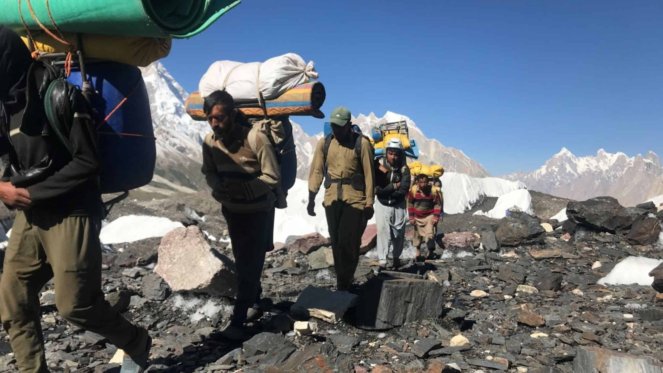 Porters carrying luggage to K2 base camp trek